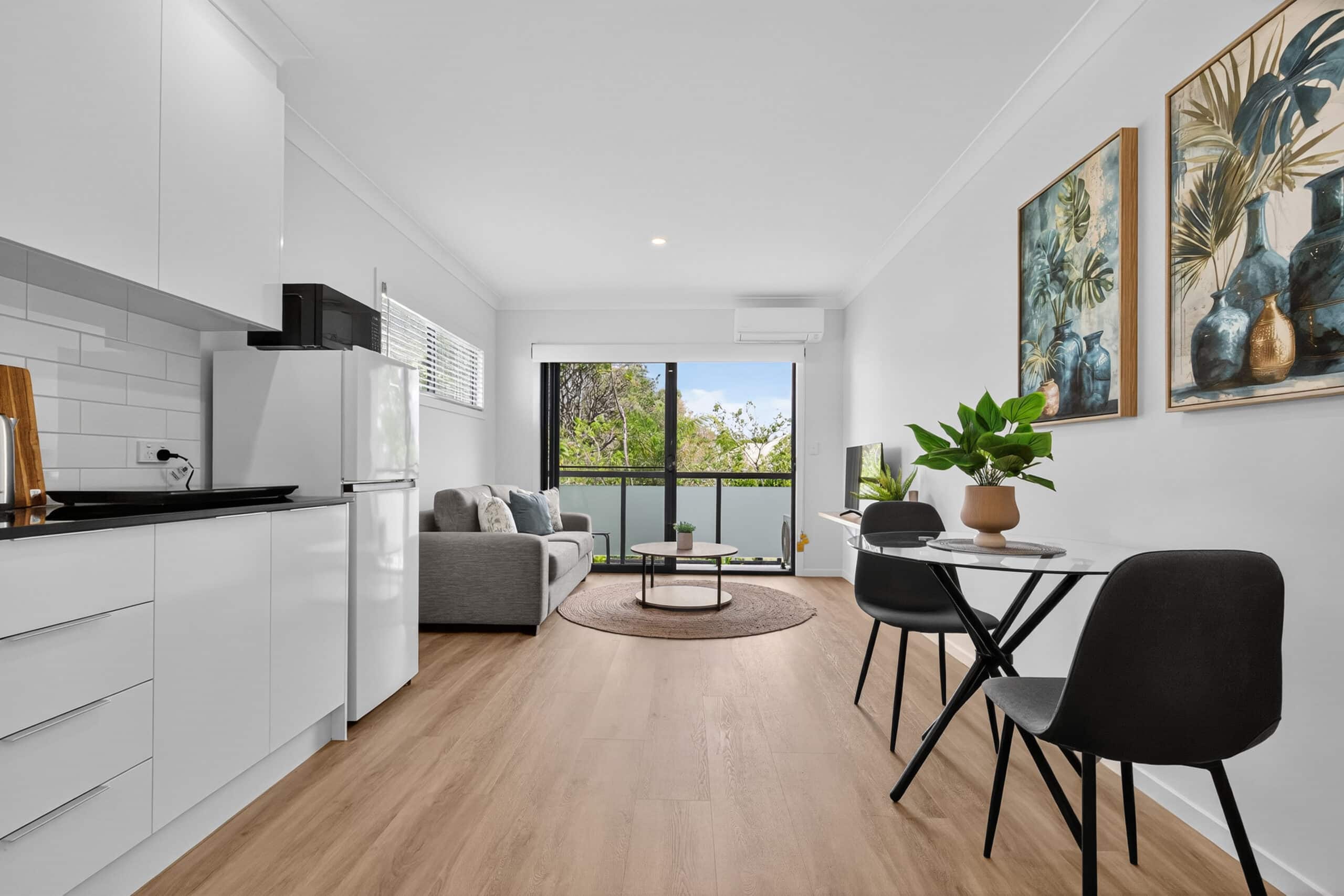 Rooming House Kitchen and Living Area — Furnished Investment Property Open plan kitchen and living area in a rooming house investment property — modern interior by Rooming House Manager